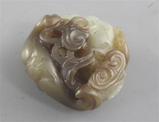 A Chinese pale celadon and brown jade carving of two bats and a dragonfly, 19th century, 3.7cm